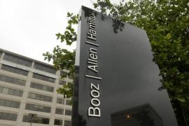 Employees of private contractor Booz Allen Hamilton routinely pass in and out of government [EPA]