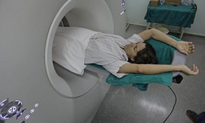 A woman lies during a scan in the tomography section of Havana''s main cardiology and heart surgery hospital