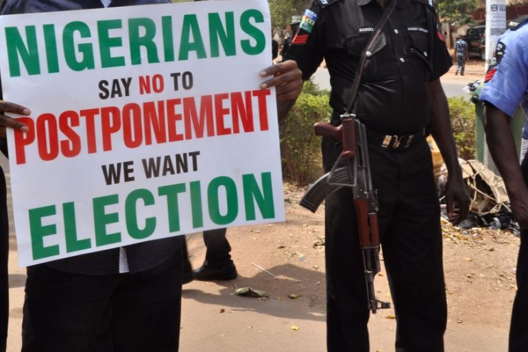 People demonstrate against a decision to postpone Nigeria''s elections
