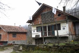 A house in the Bosnian village of Gornja Maoca decorated with Islamic State flags
