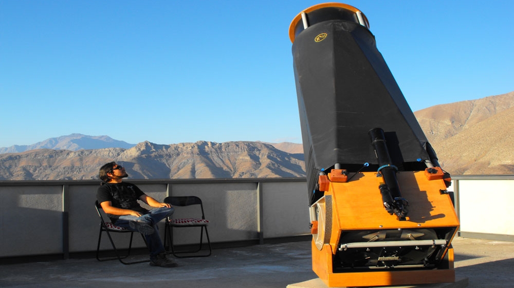 Observatory founder Cristian Valenzuela with one of the telescopes at Pangue [Pangue Observatory]