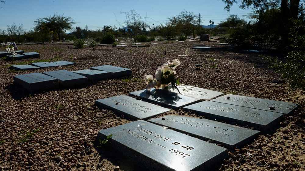 Bodies of unidentified migrants are buried at a barren corner of the Evergreen Cemetery in Tucson [Felix Gaedtke /Al Jazeera] 