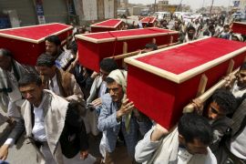 People carry the coffins of victims of a Saudi-led air strike, during their funeral in Sanaa