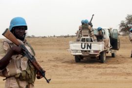 UN peacekeepers stand guard in the northern town of Kouroume