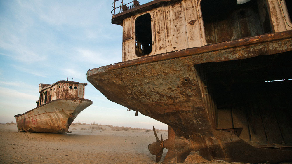 Boats in the sands of Aralkum rust away as a symbol of the Aral Sea disaster, one of the worst in human history [Timur Karpov/Al Jazeera]