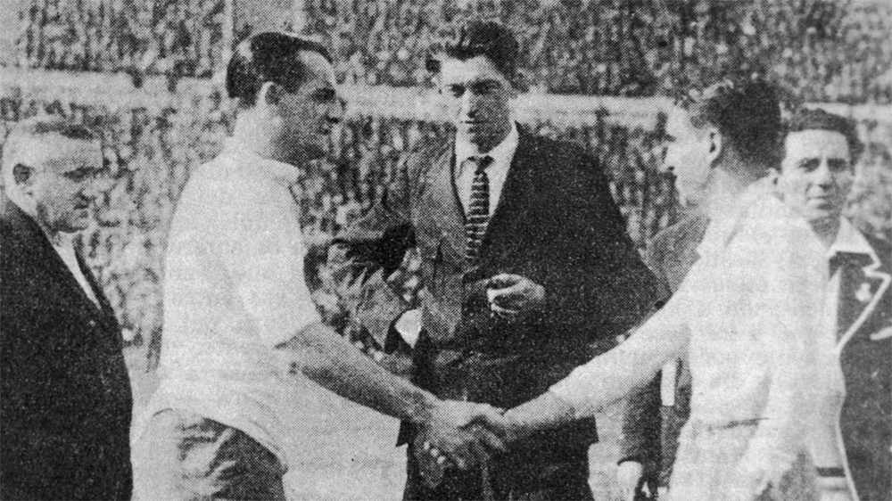 Uruguayan captain Jose Nazassi, left, shakes hands with his Argentinian counterpart 'Nolo' Fereyra before the final of the first World Cup in Montevideo, which Uruguay won 4-2 [Getty Images]