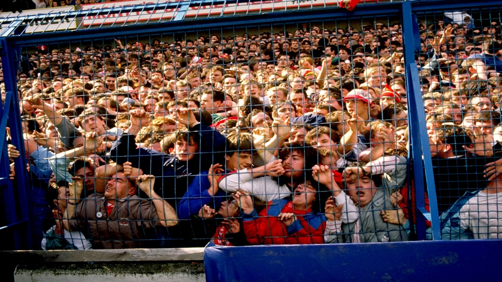 Supporters are crushed against the barrier as disaster strikes before the FA Cup semi-final between Liverpool and Nottingham Forest at the Hillsborough Stadium in Sheffield, England [Allsport]