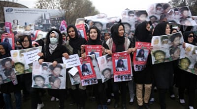 Women march in the Afghan capital of Kabul with pictures showing ethnic Hazaras who were allegedly killed by the Taliban [AP]
