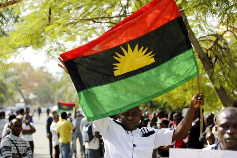 A supporter of Indigenous People of Biafra (IPOB) leader Nnamdi Kanu holds a Biafra flag during a rally in support of Kanu, who is expected to appear at a magistrate court in Abuja