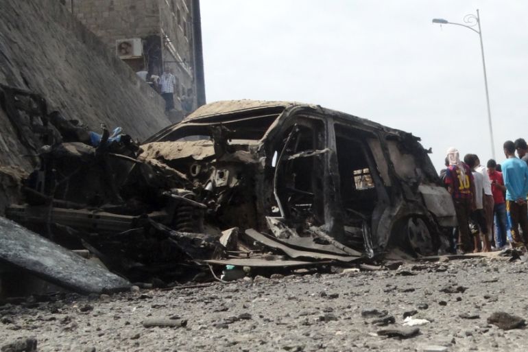 People gather at the site of the a car bomb attack that killed the governor of Yemen''s southern port city of Aden