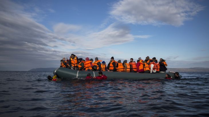 Refugees and migrants arrive on an inflatable vessel to Lesbos