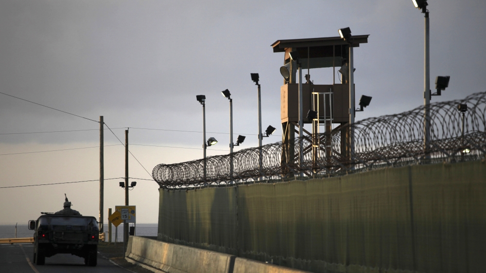 A guard looks out from a tower at the detention facility of Guantanamo Bay US naval base in Cuba [AP]