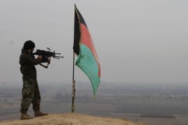A member of the Afghan security forces takes up a position during an operation against Taliban fighters in Kunduz [EPA]