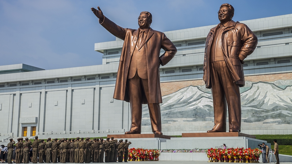Soldiers salute bronze statues of Kim Il-Sung and Kim Jong-Il at the Mansudae Grand Monument in Pyongyang, North Korea [breathoflifestar]