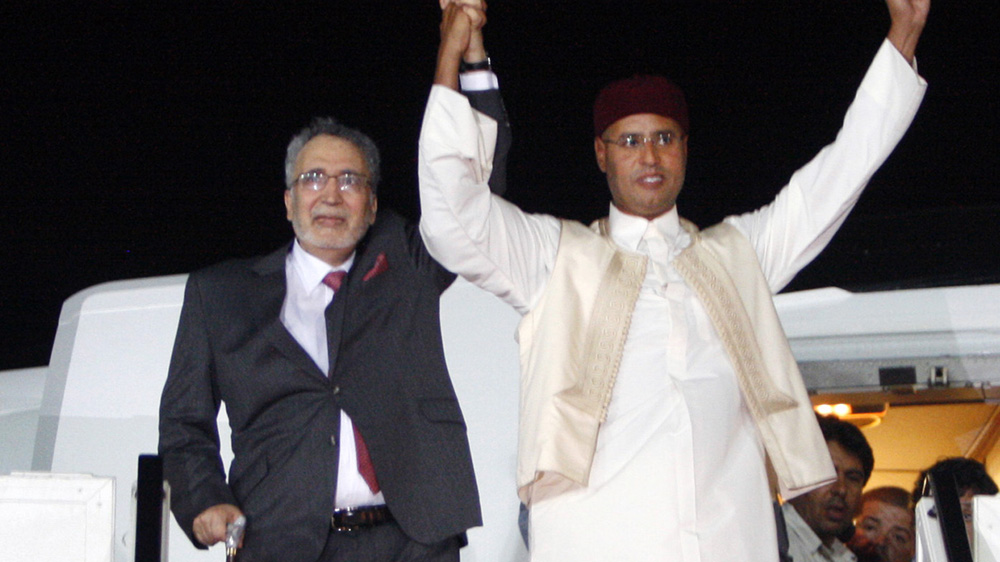 Abdel Baset al-Megrahi (L) is welcomed by Saif al Islam Gaddafi, son of the former Libyan leader, after being released on humanitarian grounds and returned to his homeland in 2009 [AP]
