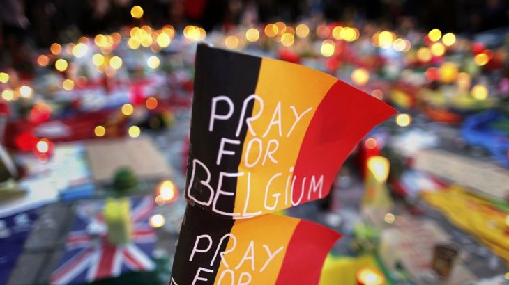 Belgian flags seen at a street memorial service in Brussels following bomb attacks in Brussels, Belgium
