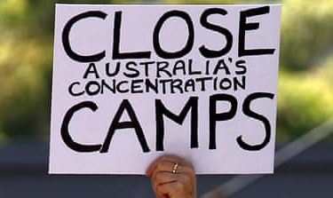File picture of a protester holding a placard during a rally in support of refugees in central Sydney, Australia