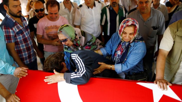 Relatives of a victim of Tuesday''s attack on Ataturk airport mourn at her flag-draped coffin during her funeral ceremony in Istanbul