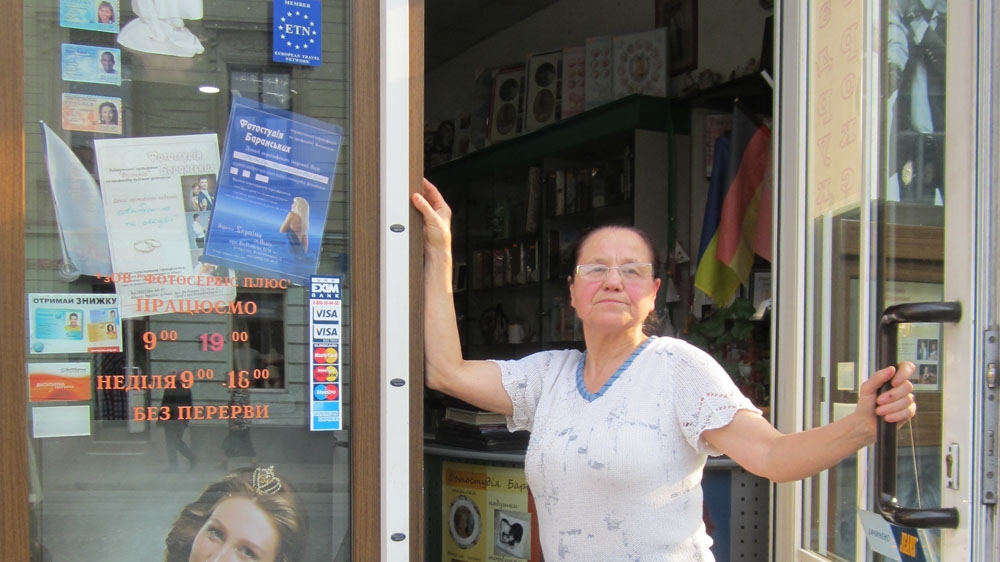  Maria Baranska at the door to her shop [Chris Scott/Al Jazeera] 