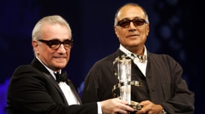 Kiarostami receives an award from Martin Scorsese at the 5th Marrakesh International Film Festival in 2005 [Reuters] 