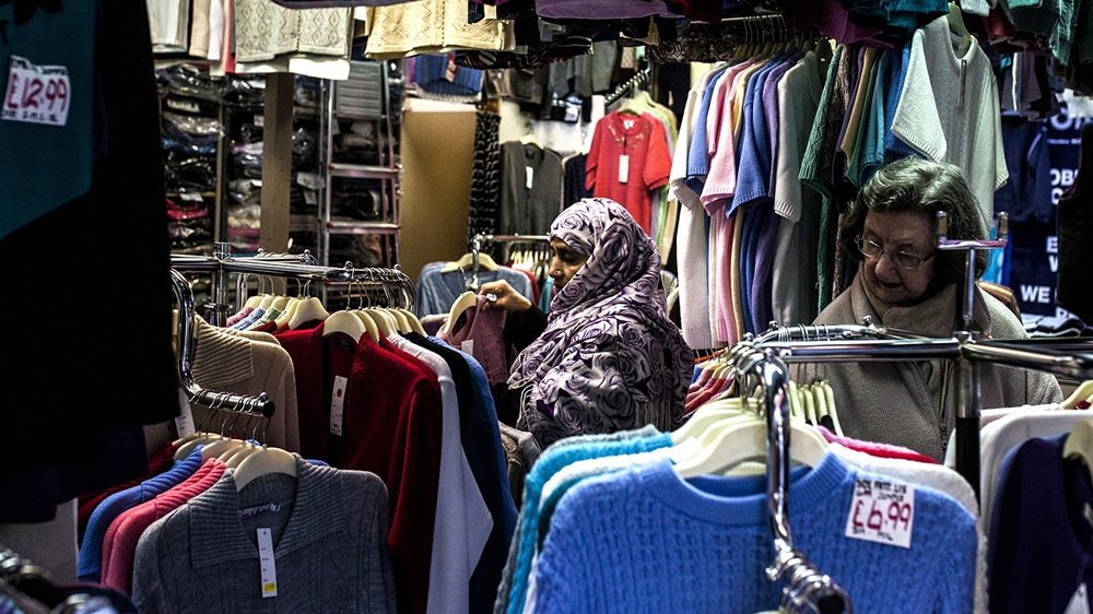 Oldham's town centre is not as visibly divided as people from all communities use its services [David Shaw/Al Jazeera] 