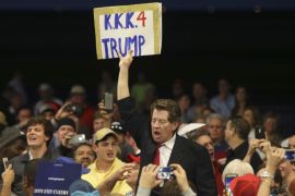 A protestor holds up a sign in the midst of Republican U.S. presidential candidate Donald Trump''s campaign rally in New Orleans, Louisiana