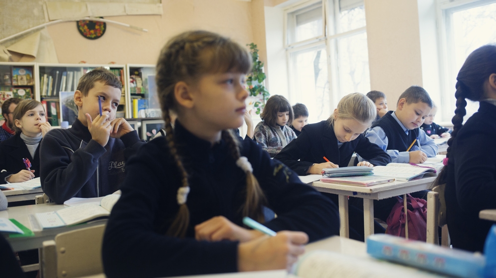 Pupils attend classes at the school [Kyrre Lien/Al Jazeera] 