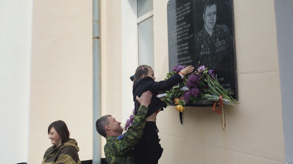 On Veterans' Day, the pupils honour those who have been killed in combat during the war between the Ukrainian army and the Russian-backed rebels [Kyrre Lien /Al Jazeera]  