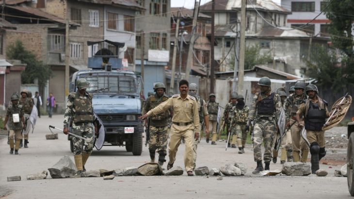 Indian police in Kashmir