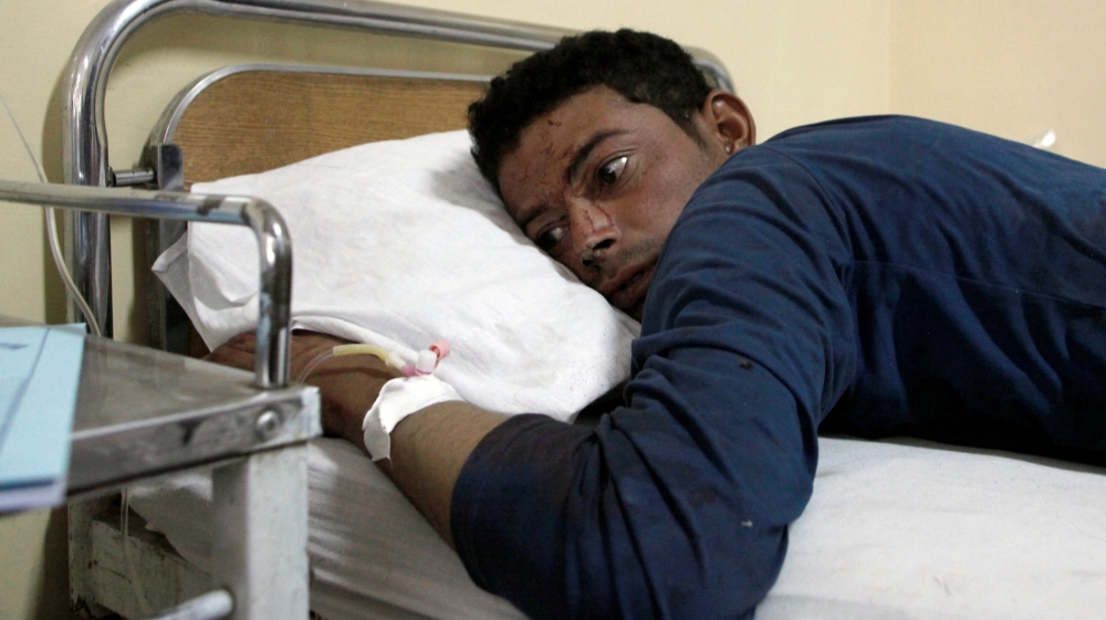 A police cadet, who was injured in the attack, lies in a hospital in Quetta on Tuesday [Reuters]