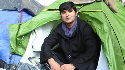 Rahman Safi, 28, from Afghanistan, arrived at Jaures around two weeks ago. He is currently trying to raise money for train and metro tickets so he can follow-up his asylum request [Lorraine Mallinder/Al Jazeera] 