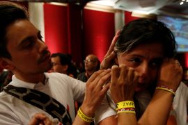 A supporter of "Si" vote cries after the nation voted "NO" in a referendum on a peace deal between the government and FARC rebels at Bolivar Square in Bogota