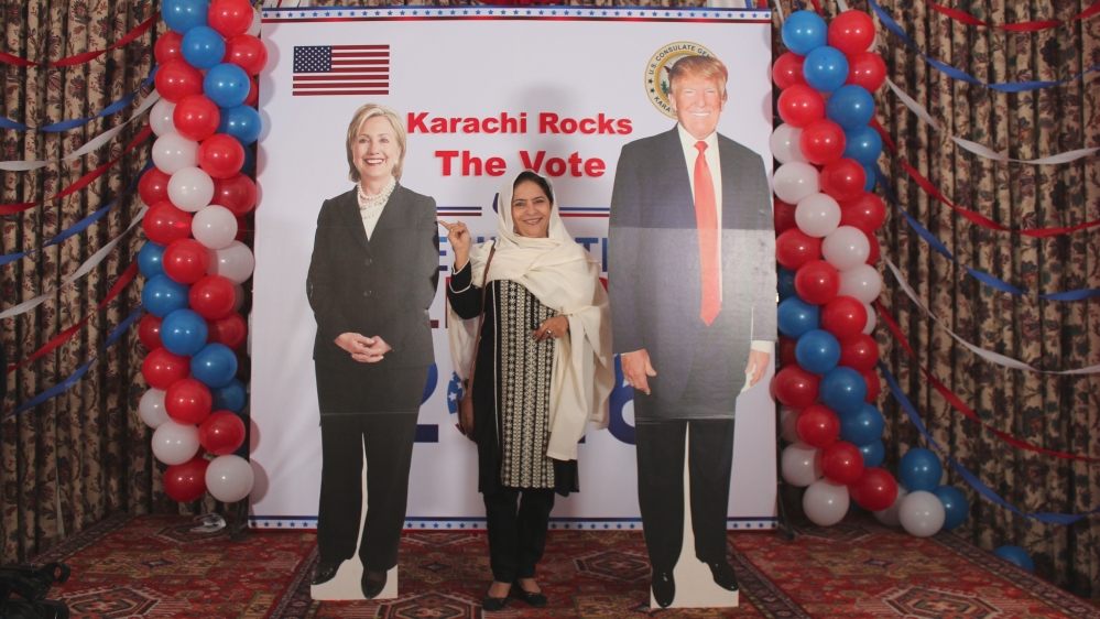 Guests of the consul general took photos with the candidates [Sanam Maher/Al Jazeera]