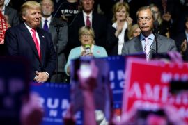 Republican presidential nominee Donald Trump watches as Member of the European Parliament Nigel Farage speaks at a campaign rally in Jackson