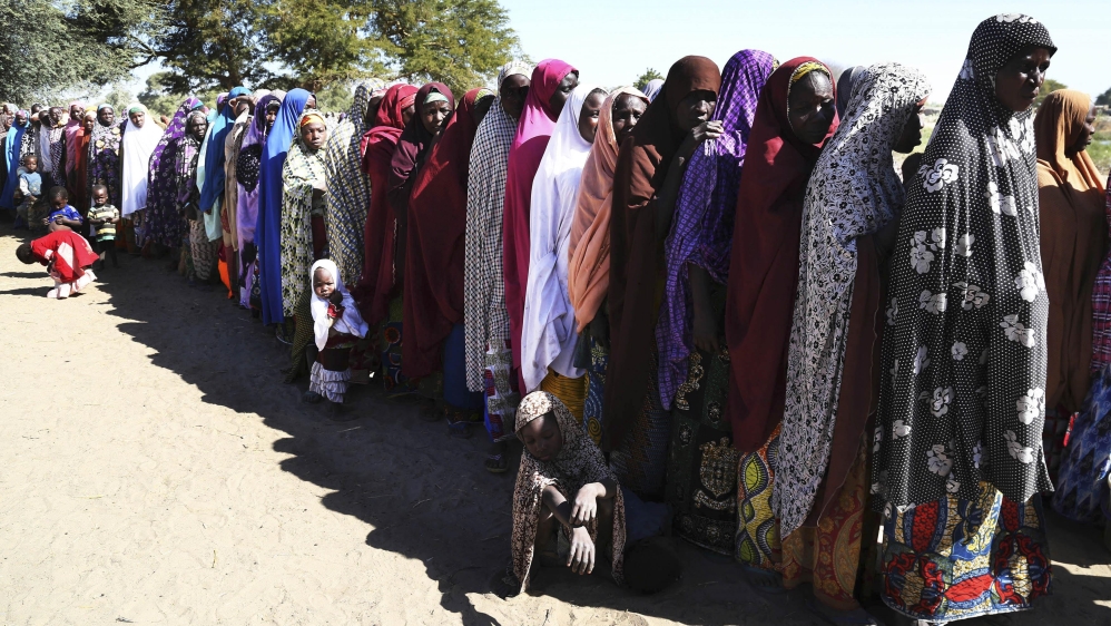 Women who have fled violence in Nigeria queue for food at a refugee welcoming centre in Ngouboua, Chad [Reuters/Emmanuel Braun] 