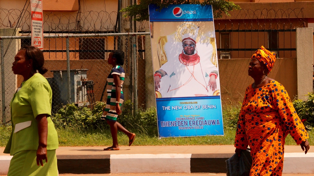 The whole of Benin City is decorated with flags and banners honouring the new Oba [Femke van Zeijil/Al Jazeera] 
