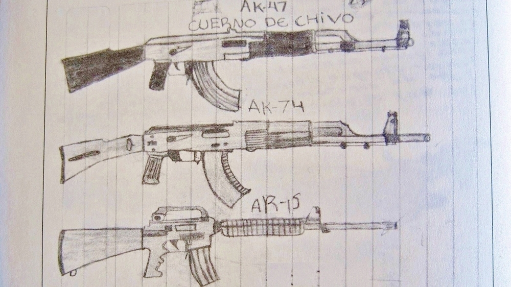 A collection of Kalashnikov and Armalite assault rifles [Stephen Woodman/Al Jazeera] 