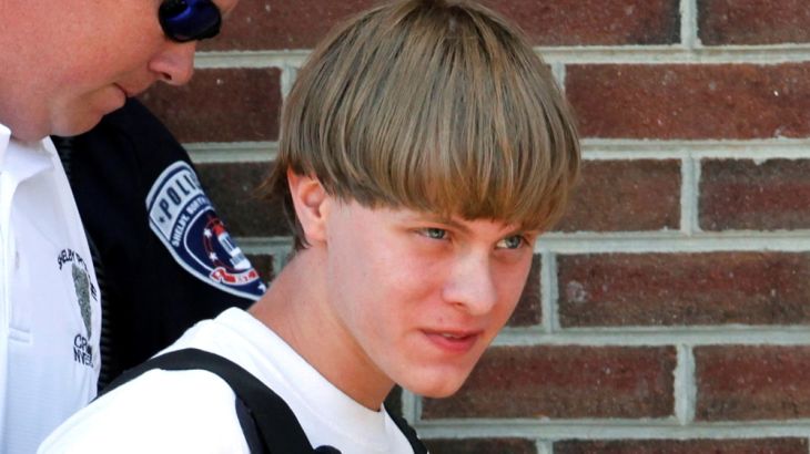 File photo of olice leading suspected shooter Dylann Roof into the courthouse in Shelby, North Carolina
