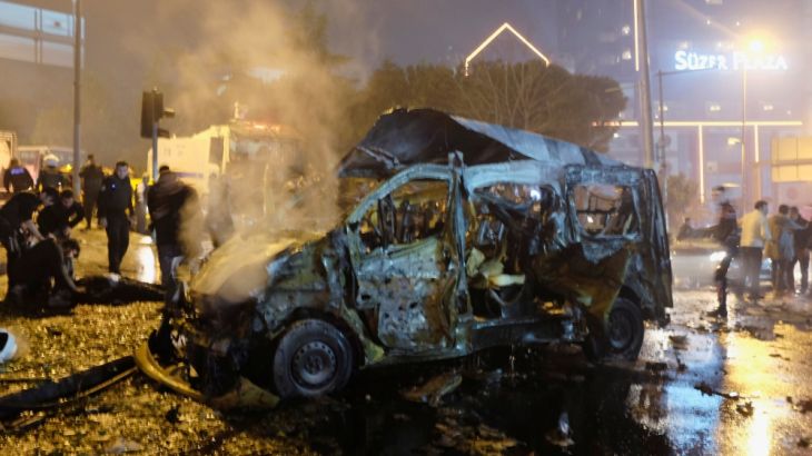 A damaged vehicle is seen after a blast in Istanbul