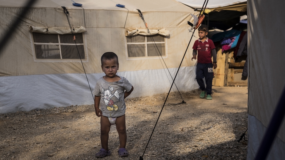A young boy wanders around the camp in Oinofyta, Greece, September 2016 [Fahrinisa Oswald/Al Jazeera]