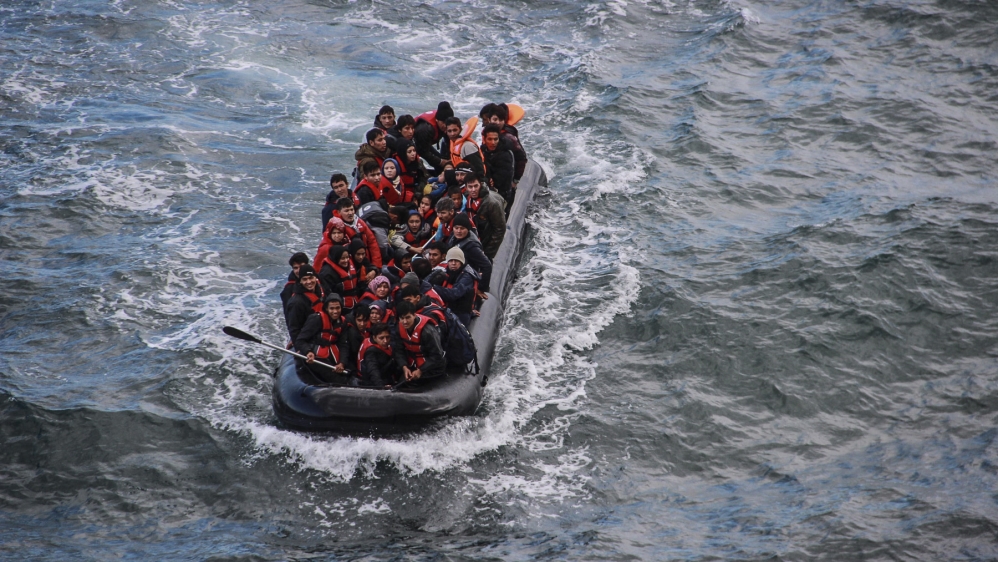 A rubber dinghy carrying Syrian, Afghan and Iraqi asylum seekers approaches the shores of Lesbos in October 2015. An estimated 95,000 asylum seekers have arrived in Greece since January 2016, down from more than 600,000 in 2015 [Fahrinisa Oswald/Al Jazeera]