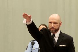 Anders Behring Breivik raises his right hand during the appeal case in Borgarting Court of Appeal at Telemark prison in Skien
