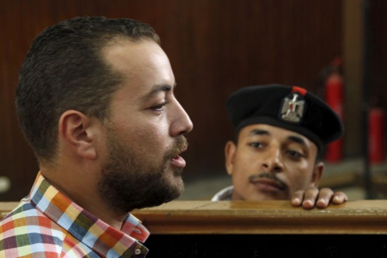 Mohamed talks to journalists before hearing the verdict at a court in Cairo