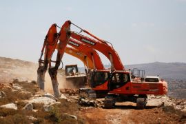 Heavy machinery work on a field as they begin construction work of Amichai, a new settlement which will house some 300 Jewish settlers evicted in February from the illegal West Bank settlement of Amo