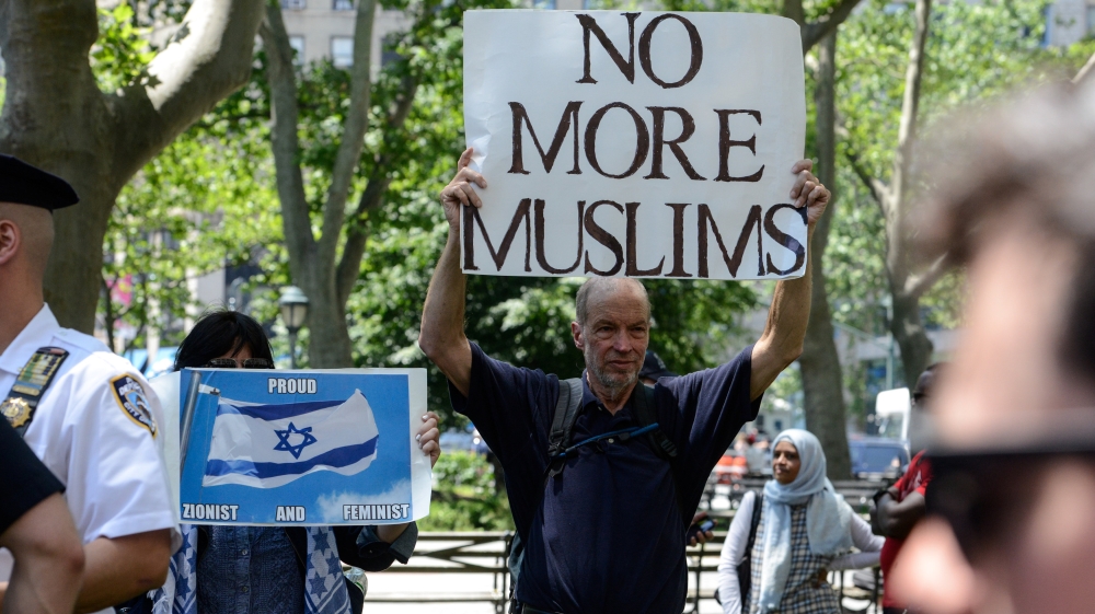 A man holds a placard during an event called 'March Against Sharia' in New York City on June 10, 2017 [Stephanie Keith/Reuters]