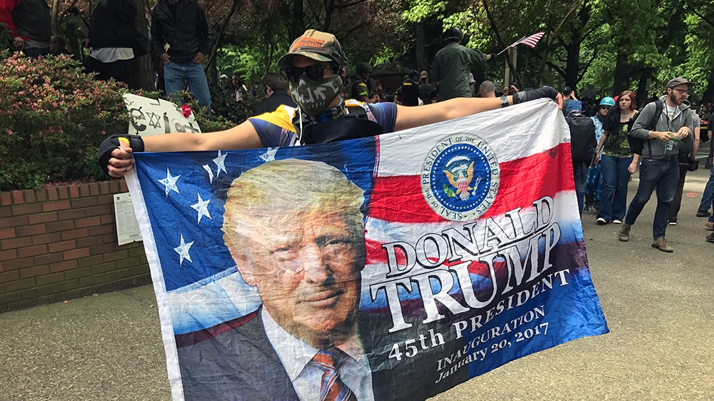 Sunday's rally included far-right activists who support US President Donald Trump [Mike Bivins/Al Jazeera]
