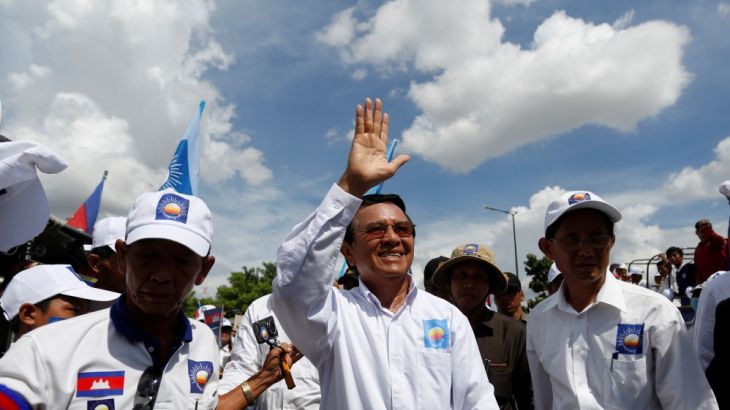 President of the opposition Cambodia National Rescue Party Kem Sokha arrives at a campaign rally in Phnom Penh