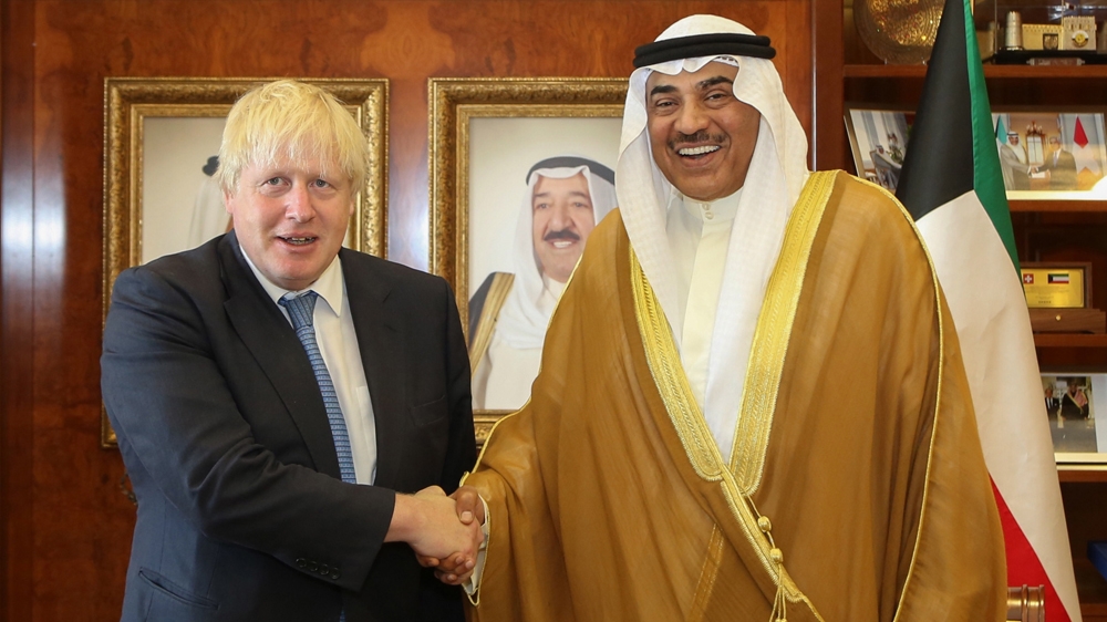 Boris Johnson, pictured here with the Kuwaiti Foreign Minister Sheikh Sabah al-Khaled al-Sabah, has angered Muslims with his Islamophobic commentary on the full face veil [Handout/KUNA/AFP]