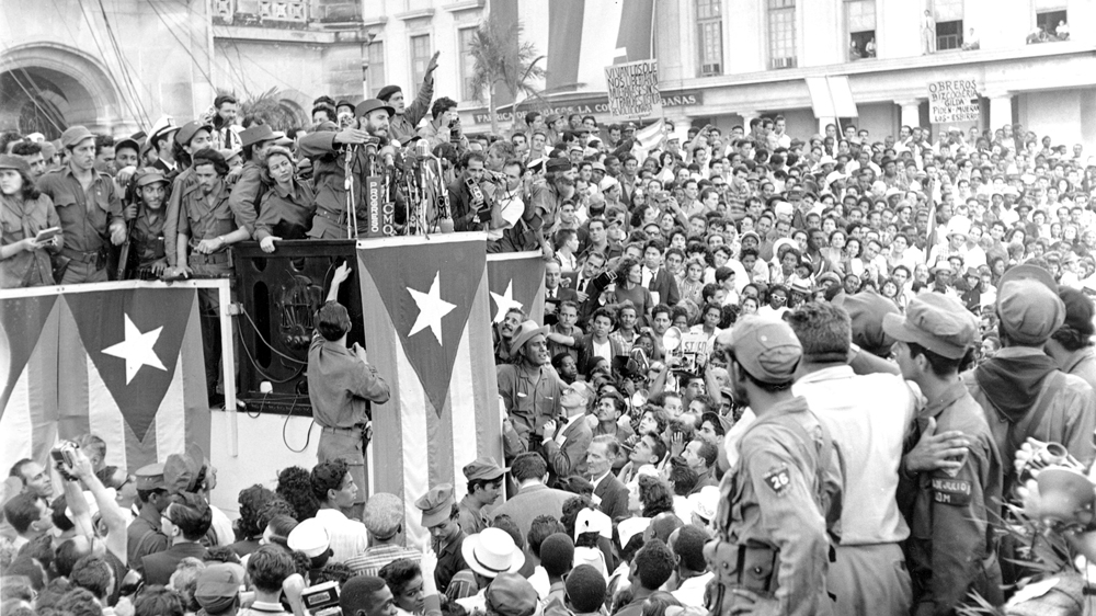 Fidel Castro addresses a crowd in front of the presidential palace in Havana shortly after declaring the Cuban revolution a success in January 1959 [Harold Valentine/The Associated Press]