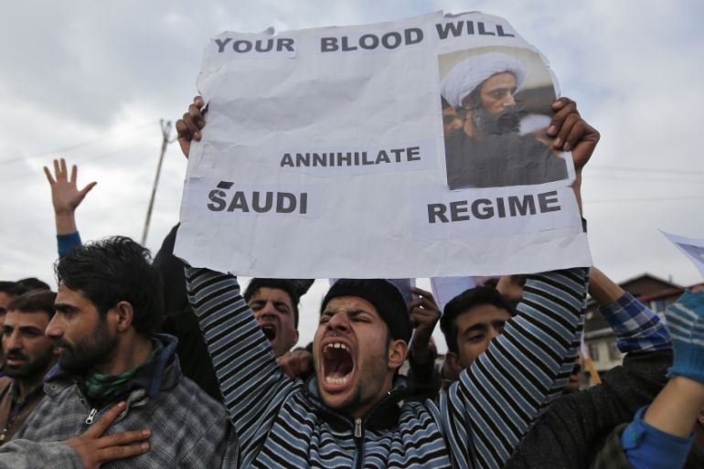 Shi''ite Muslims shout slogans during a protest against the execution of cleric Nimr al-Nimr, who was executed along with others in Saudi Arabia, on the outskirts of Srinagar